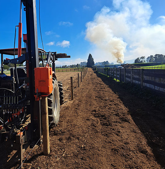 Tractor with post driver